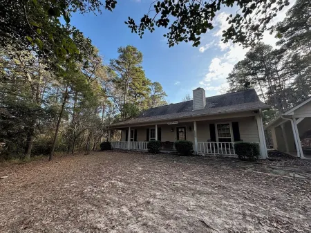 Our Happy Place is located in the gated community of Holly Lake Ranch.