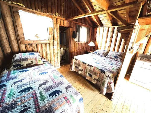 Classic original cedar log cabins set on Simms Stream in the North East Kingdom.