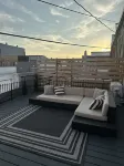 Stylish & Modern 2-Bdrm Apt in Downtown Warsaw featuring an urban rooftop deck.