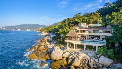 Stunning contemporary oceanfront villa with sandy beach, full staff sleeps 14 Hotels in 