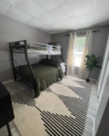 Charming 2-bedroom cottage with lake and beach access and large yard.