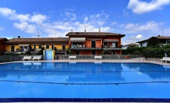 Apartment with One Bedroom in Pacengo, with Shared Pool, Furnished Terrace and Wifi - Near the Beach