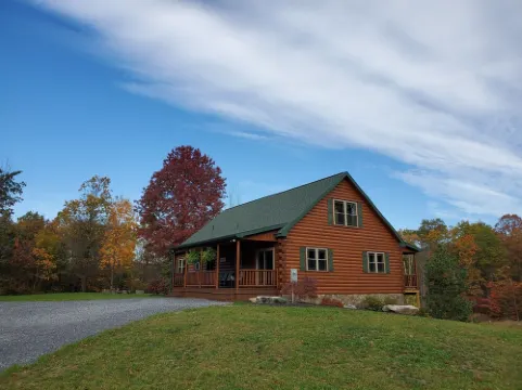 Cozy cabin in tranquil setting overlooking pond