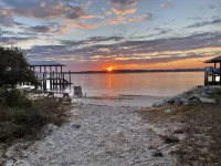 New Luxury heated pool home, steps to the beach with two master suites!
