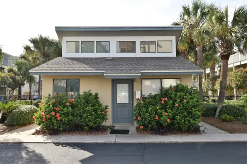 Charming 1Br Condo on the beach with pool outside back door and beach access.