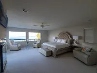 Relaxing in an Entire 5,400sf Beach View Home With Indoor Heated Swimming Pool.