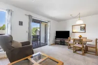 Balcony View and Golf Course Access - Stylish Escape Hotels in Oliver Township