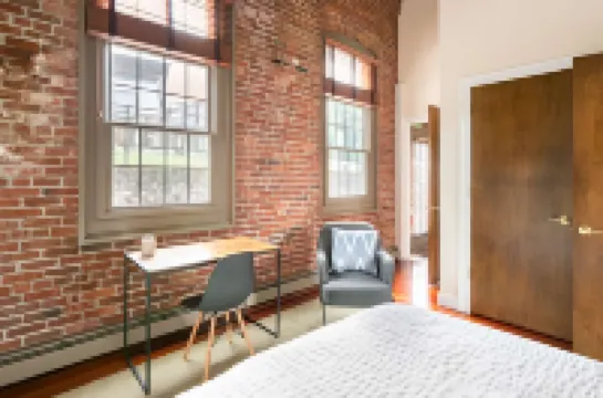 Private Patio and Historic Loft Feel - Charming Foundry Retreat