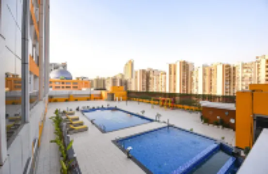 FabHotel Prime Spectrum Metro - with Pool |  5 Mins Walk from Sector 75 Metro