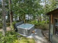 Stunning Waterfront Retreat with Hot Tub and Stone Fireplace - Enchanting Escape