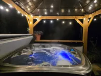 Cozy river cabin with hot tub, great fishing, and peaceful nature views.