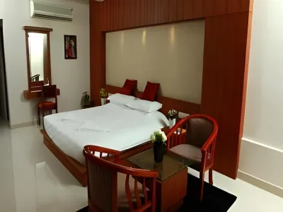 Boon Inn Hotels near Aravind Store, Plachimada