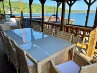 AMAZING WATERFRONT HOME WITH HOT TUB. BOTH HAVE EXTENSIVE VIEWS OF THE LAKE