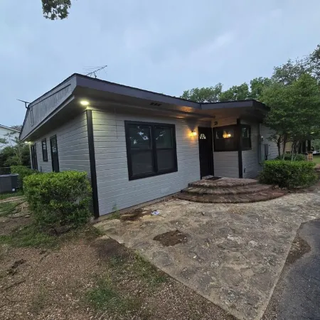 Newly Renovated 1.5 Acre Lake Front Home with Game Room and Direct Lake Access.