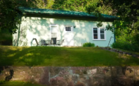 Remodeled home in the woods, just past city limits. With horse pasture nearby!