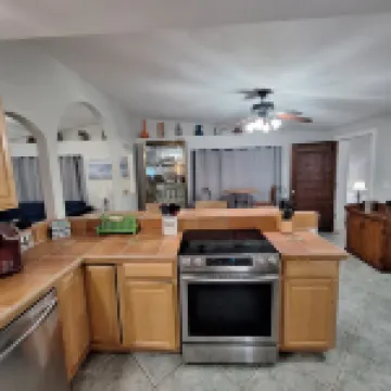 Lagoon shaped pool home with private back yard!