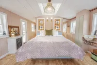 Insanely romantic treehouse perched next to a stream and rolling hills.