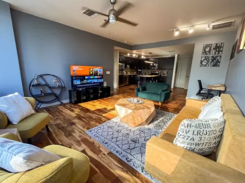 Cozy Retreat with Rooftop Pool, Parking, and Spacious Comfort