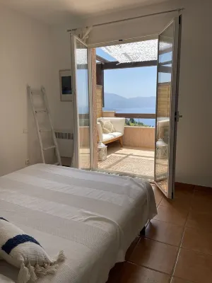 House with large terrace, garden  and spectacular sea view. Very quite area.