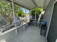 Charming Villa with Screened Lanai and Golf Cart - Cozy Oasis Retreat