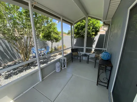 Charming Villa with Screened Lanai and Golf Cart - Cozy Oasis Retreat