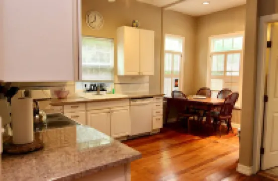 Private Backyard with Charcoal Grill and Porch - Charming Cozy Haven