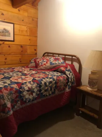 Cozy Cabin in the Woods in a Relaxing Area with Wrap Around Porch Rocking Chairs