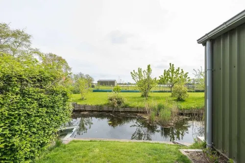 Characteristic farmhouse on the dike Hotels in Andijk