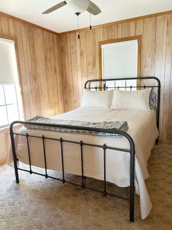 3-bedroom cabin nestled on 80 acres with WiFi, AC on private 5-acre lake.