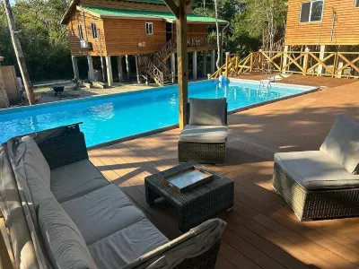 Sade's Enchanted cabin Luxurious Jungle Cabin near the River with AC and WIFI Hotels in 