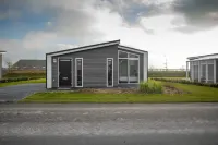 Chalet with Fireplace near Oosterschelde