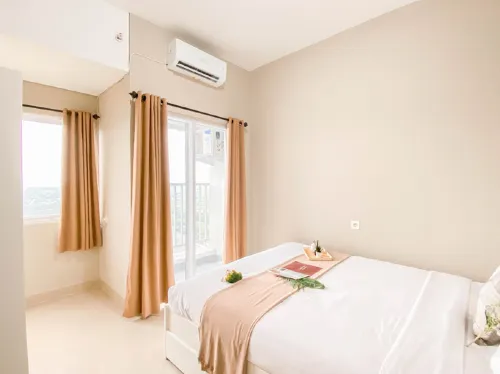 Cream Tone 1BR at Royal Sentul Park Apartment By Travelio