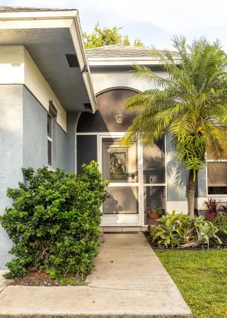 Quintessential FL Home Bursting with Color