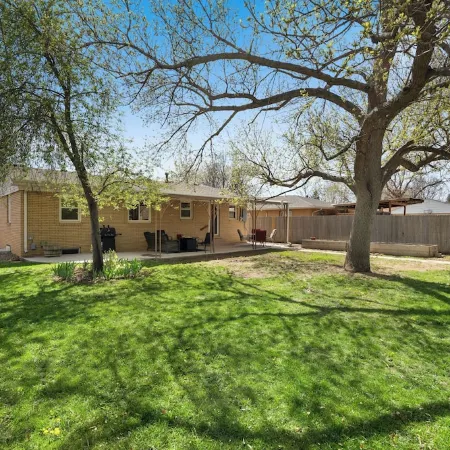 Family Friendly Central Retreat with Covered Patio, AC, Fenced Yard