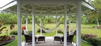 Nice little cottage oasis on a tropical fruit orchard consisting of many fruits.