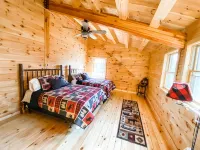 Luxury Log home steps from private beach in Meredith on Lake Winnipesaukee.