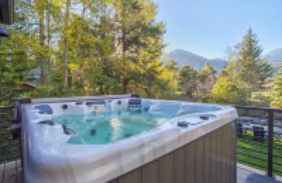 Dreamy home on river, mountain views, steps from town.