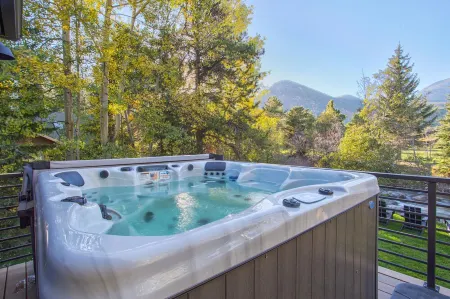 Dreamy home on river, mountain views, steps from town.