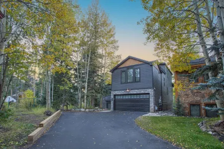 Dreamy home on river, mountain views, steps from town.