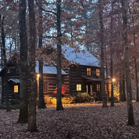 Prospect Mountain Cabin custom log home sportsman's paradise with fishing lake.