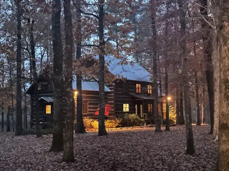 Prospect Mountain Cabin custom log home sportsman's paradise with fishing lake.