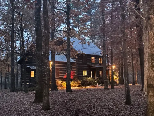 Prospect Mountain Cabin custom log home sportsman's paradise with fishing lake.