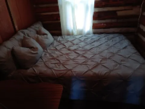 Beautiful full log cabin with  direct private frontage , beautiful sunsets .