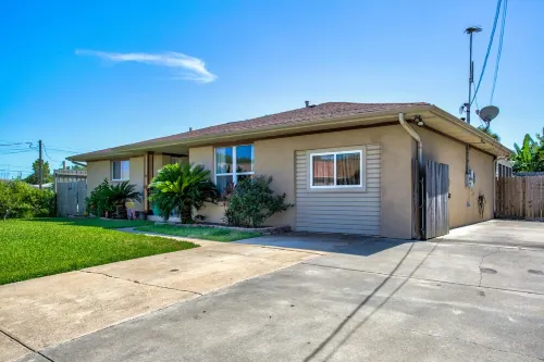 Charming private home - 2 miles to beach - heated saltwater pool & spa!