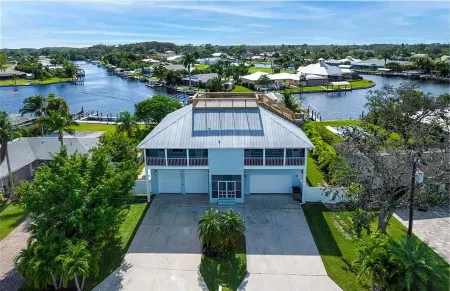 Raised home right on the Caloosahatchee River. Come enjoy the water and weather