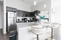 Spacious Living Area and Fully-Equipped Kitchen - Elegant Urban Retreat