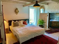 Romantic Spa Villa with Fireplace by the Lake Hotels in Hedemora