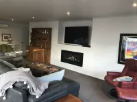 A modern house close to town and the beach and backs on to a tree lined park