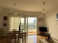 Accommodation on harbor and beach with mountain views