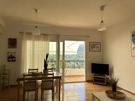 Accommodation on harbor and beach with mountain views